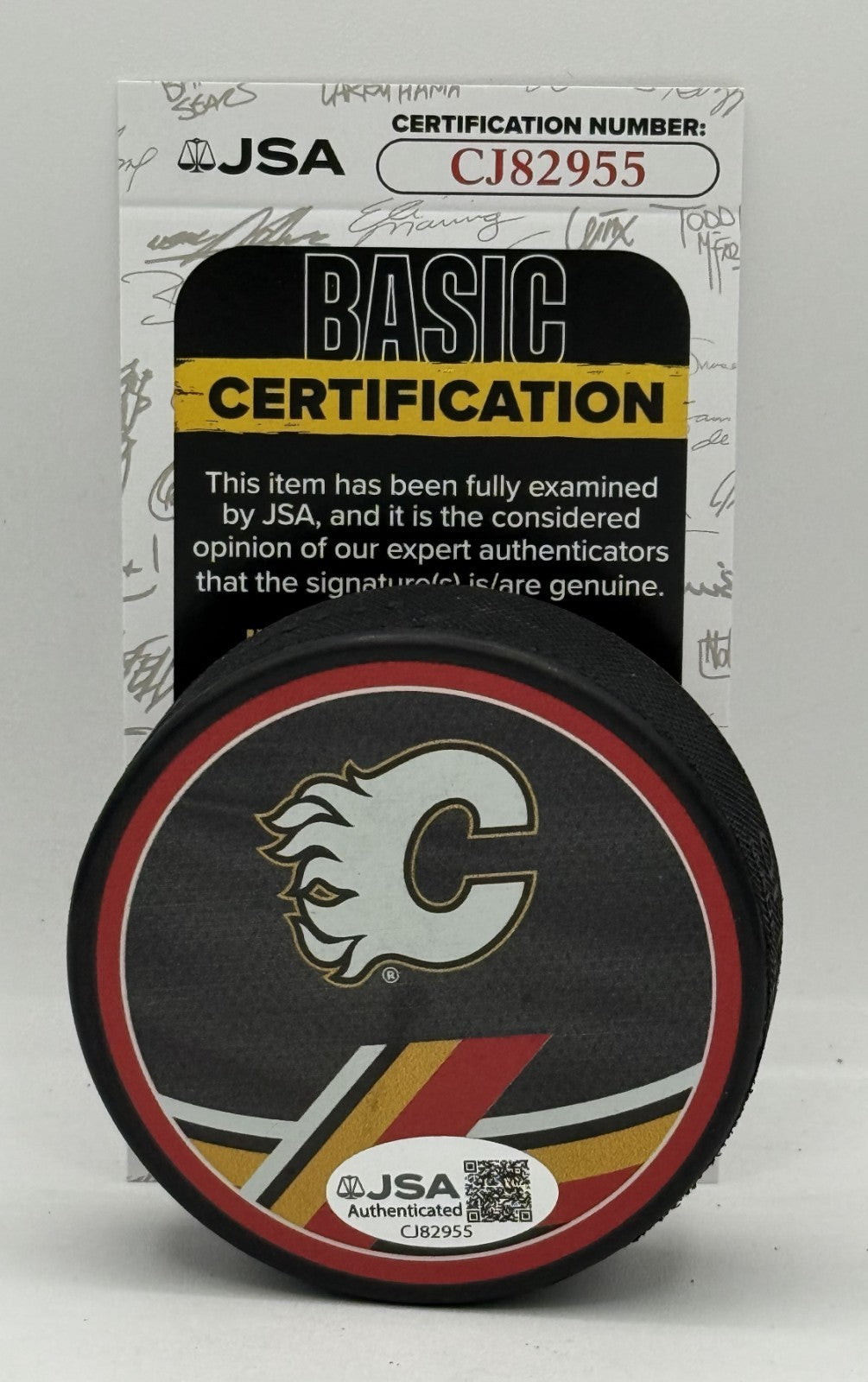 MacKenzie Weegar signed Calgary Flames Reverse Retro Puck autographed JSA